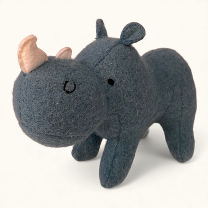 Plush rhino toy on a white background