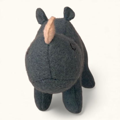 Small dark gray rhinoceros plush toy on a white background