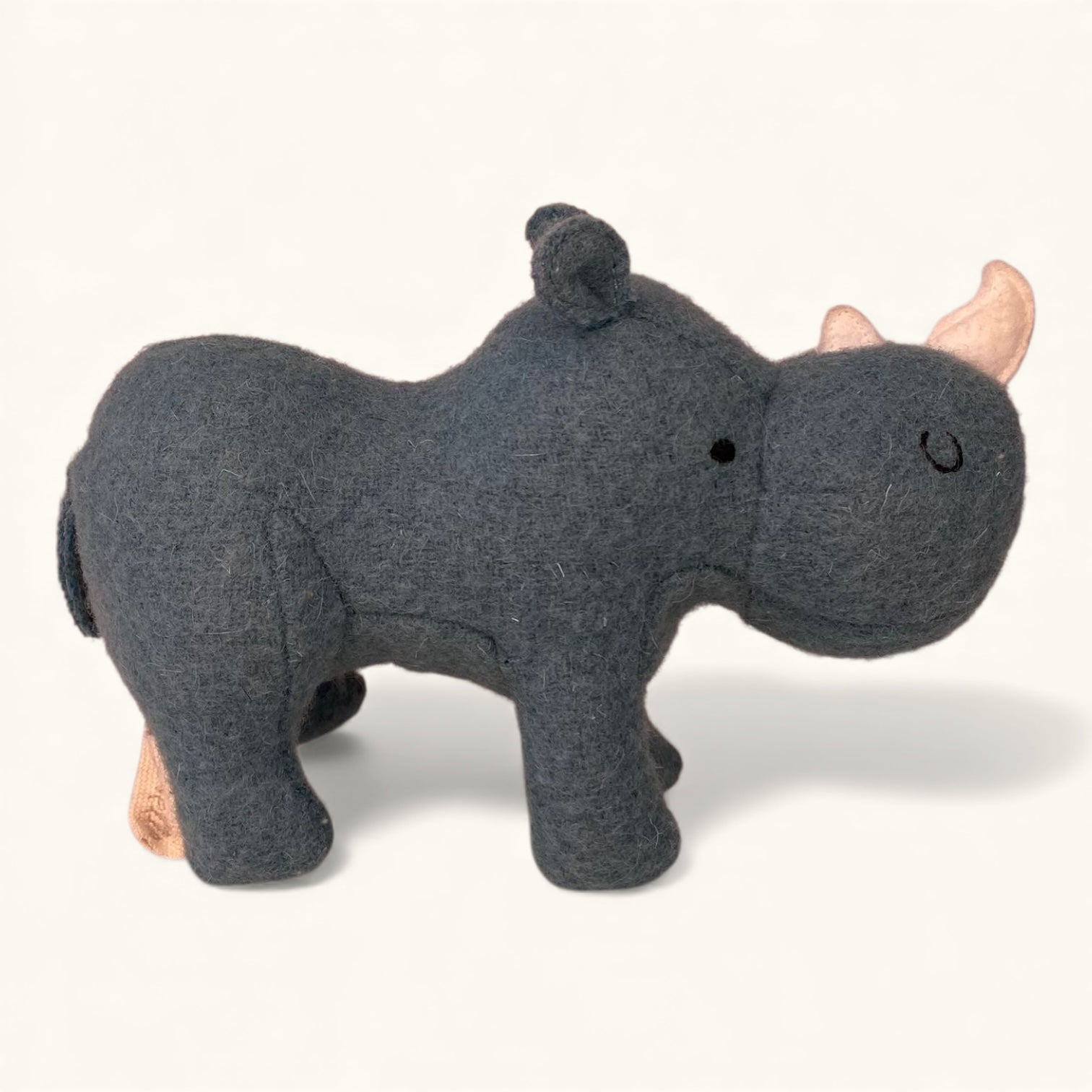 Gray rhinoceros plush toy on a white background