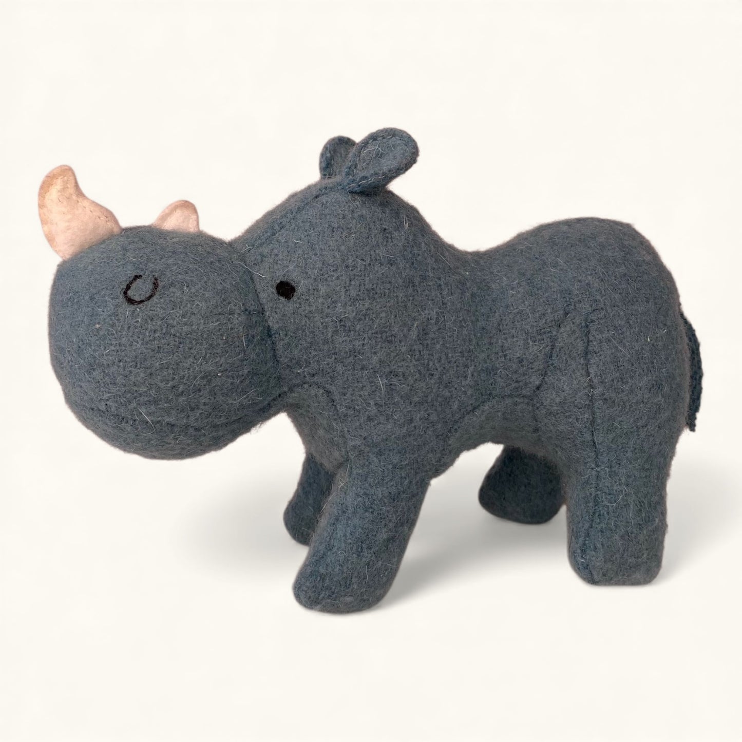 Gray rhinoceros plush toy on a white background